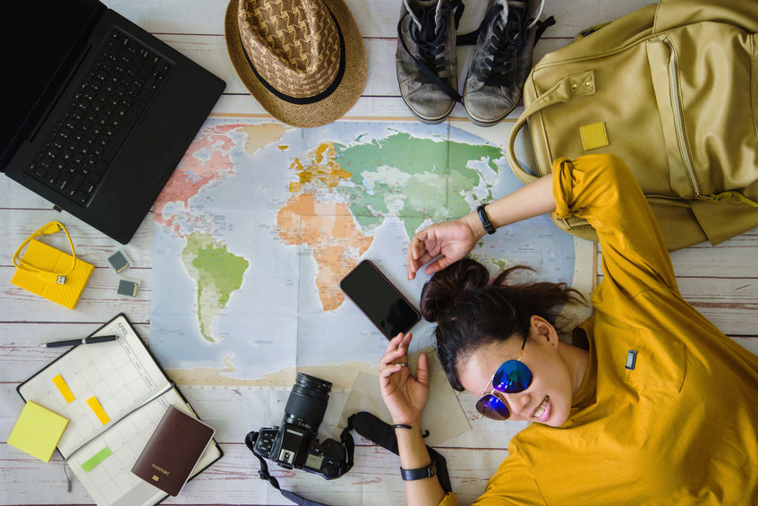 travel planning concept with map. overhead view of equipment for